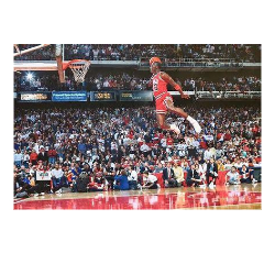 A basketball player making a slam dunk